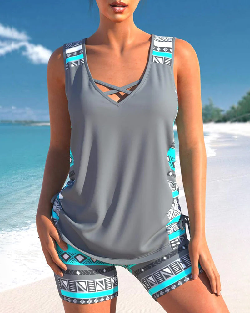 Fashionable women's two-piece tankini swimsuit with a unique criss cross neck print.