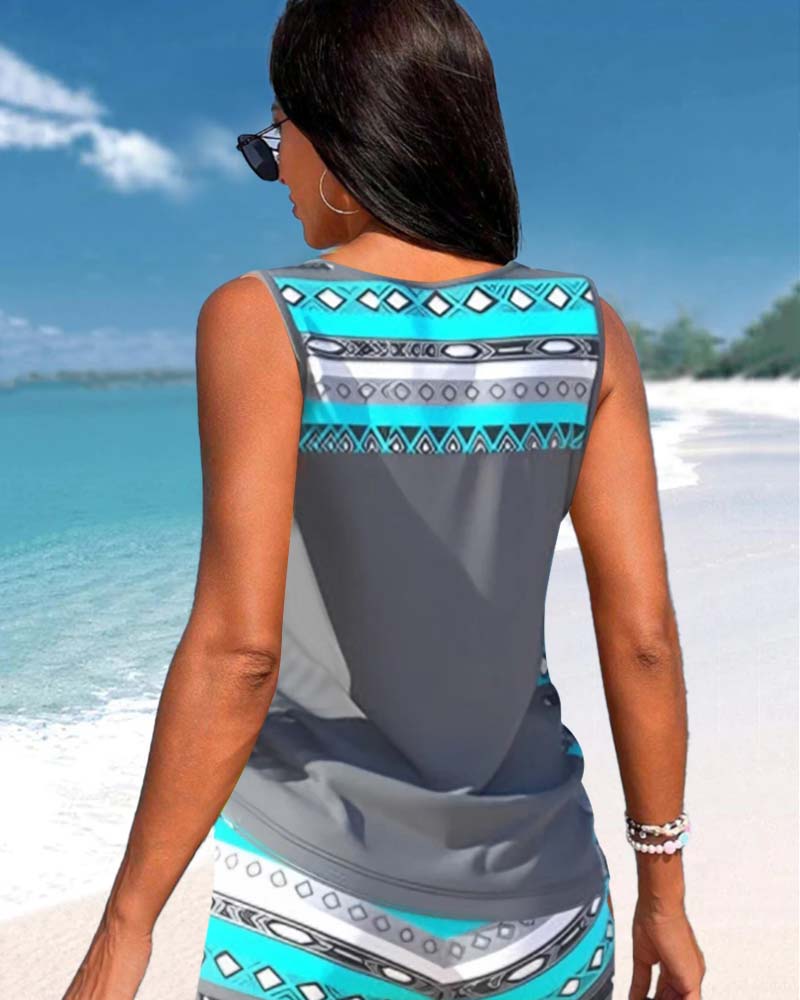 Summer-ready women's printed tankini top & bottom, a chic criss cross beachwear set.