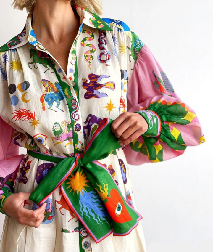 Elegant women's printed maxi shirtdress with bishop sleeves, ideal for casual or seasonal occasions.