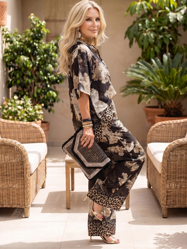 Comfortable women's two-piece set with a stylish printed wrap top & wide leg pants for summer.