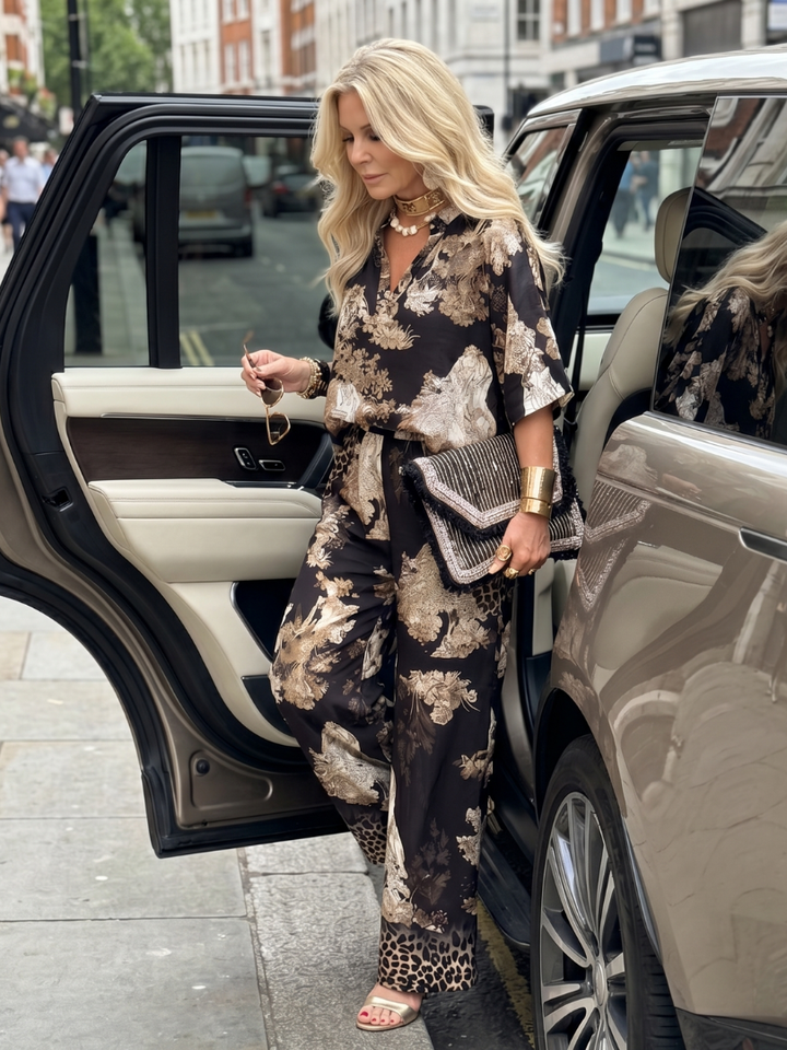 Casual chic women's matching set: printed wrap top & comfortable wide leg pants for everyday style.