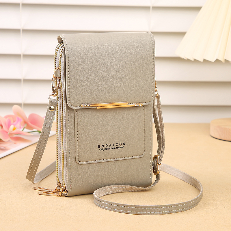 Secure travel mini bag for women, hands-free crossbody phone wallet with touchscreen, keeps essentials safe.
