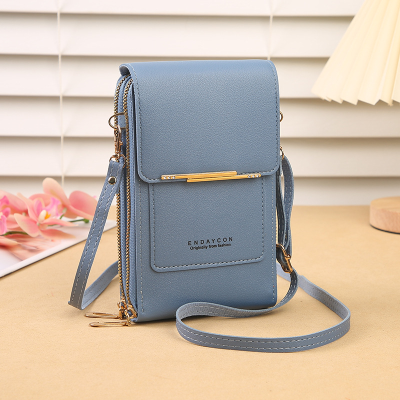 Compact women's daily bag, a crossbody phone wallet with a touchscreen window, keeps essentials organized.