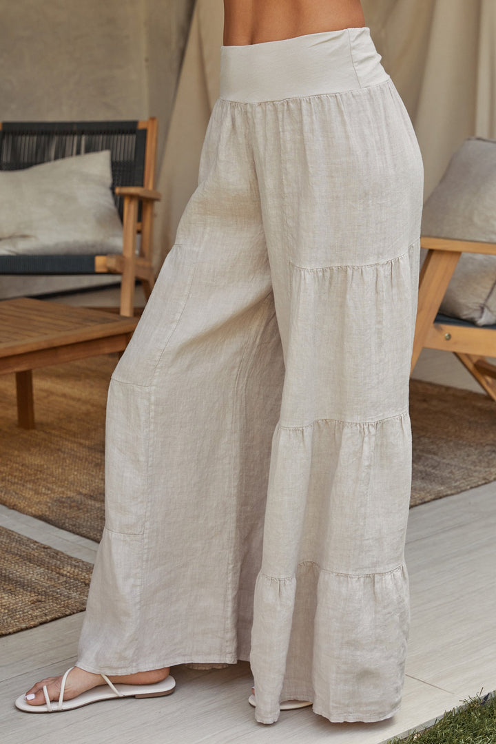 Loose fit women's linen palazzo pants, wide leg tiered for relaxed comfort.