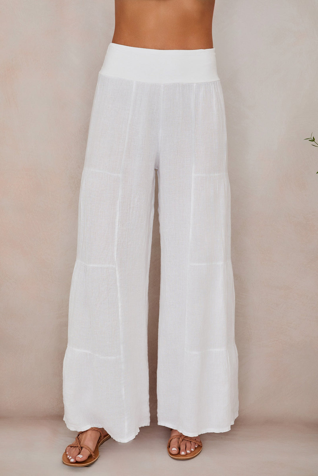 Lightweight women's linen palazzo pants, wide leg tiered for breathable comfort.