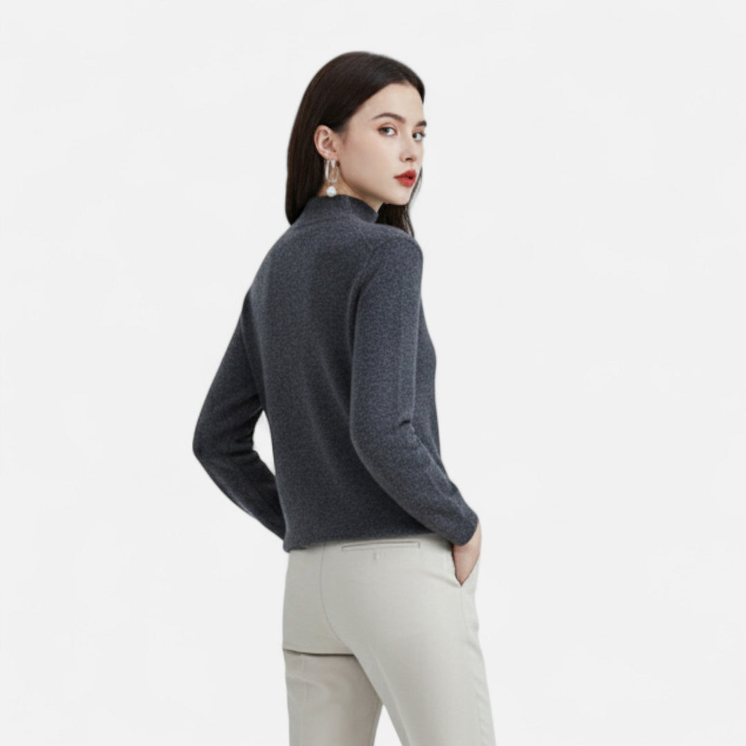 Close-up of soft pure wool texture on a women's half-neck sweater, showcasing quality knit