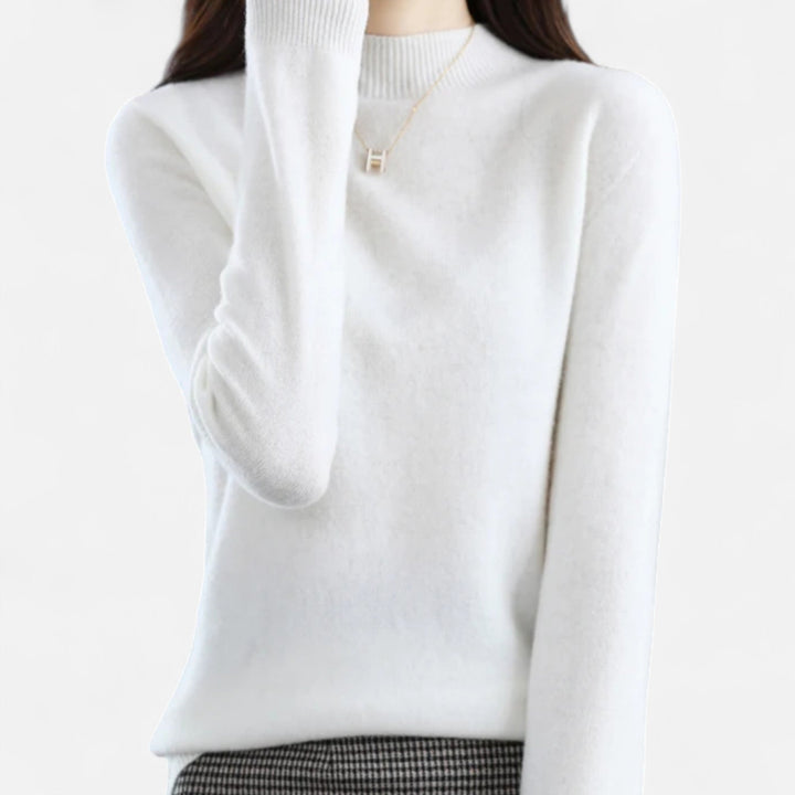 Model wearing an elegant women's pure wool half-neck sweater in a chic winter outfit