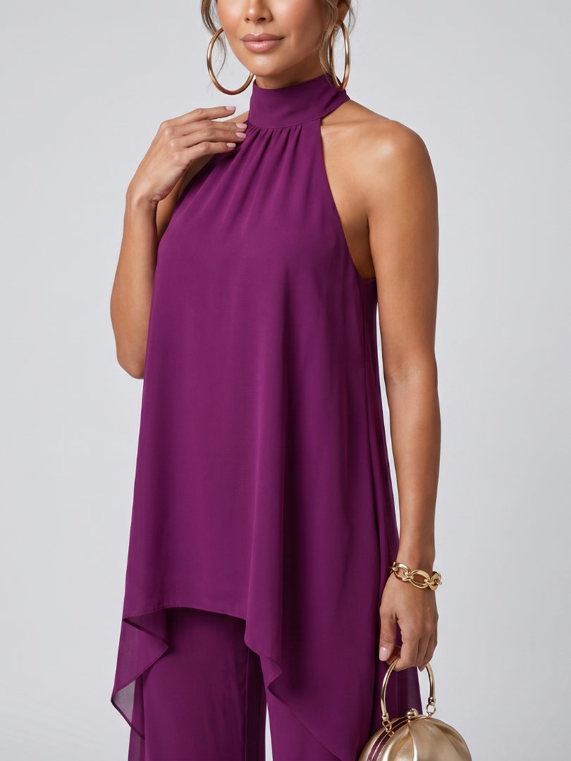 Elegant women's purple two-piece set featuring an asymmetric tunic with halter neck and comfortable wide leg pants.