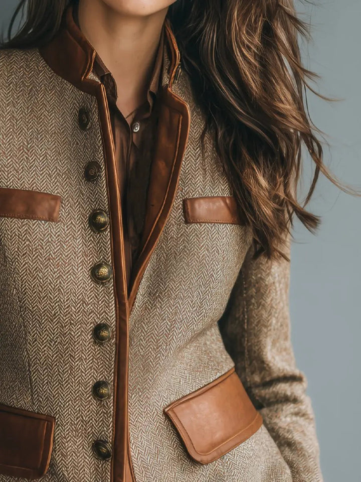 Elegant women's quilted button-up blazer, featuring luxurious leather trim and vintage herringbone design. Autumn outerwear.