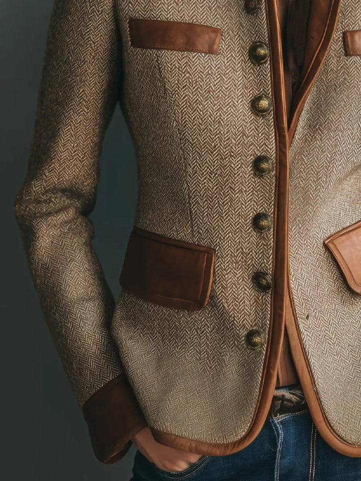 Women's tailored quilted jacket with vintage herringbone and sophisticated leather trim, great for smart casual wear.