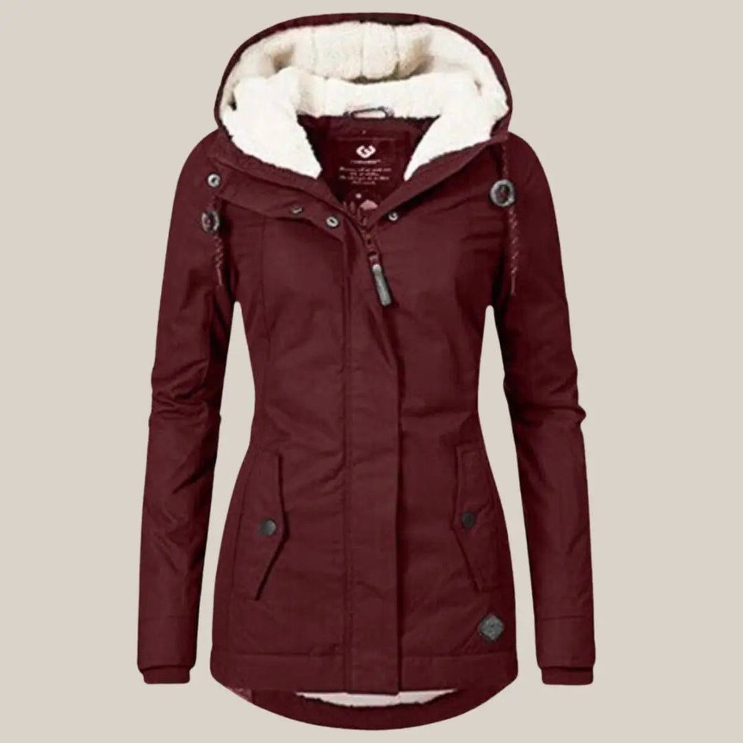 Protective women's hooded quilted outerwear, fleece-lined for superior winter warmth.