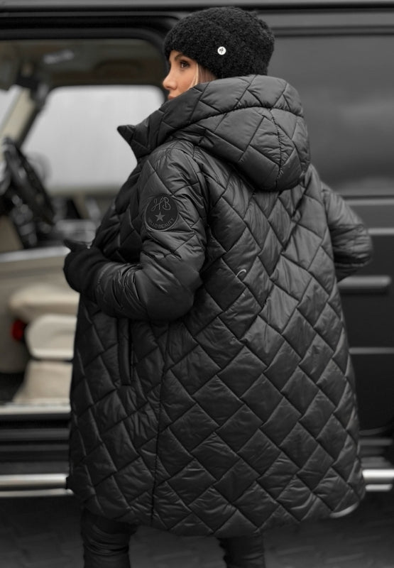 Women's open quilted jacket, hooded with diamond panels, revealing comfortable interior for fall.