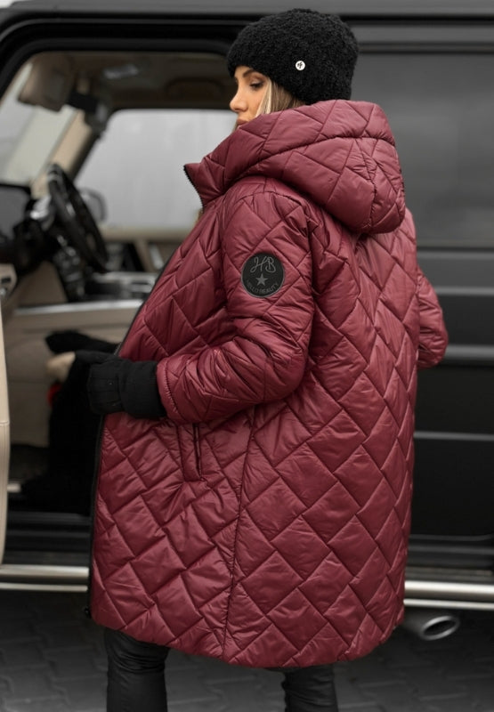 Close-up of the cozy hood on a women's diamond quilted jacket, perfect for winter warmth.