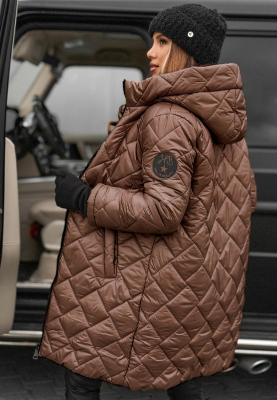Women's diamond quilted jacket with hood, folded neatly, showcasing its elegant fall outerwear design.