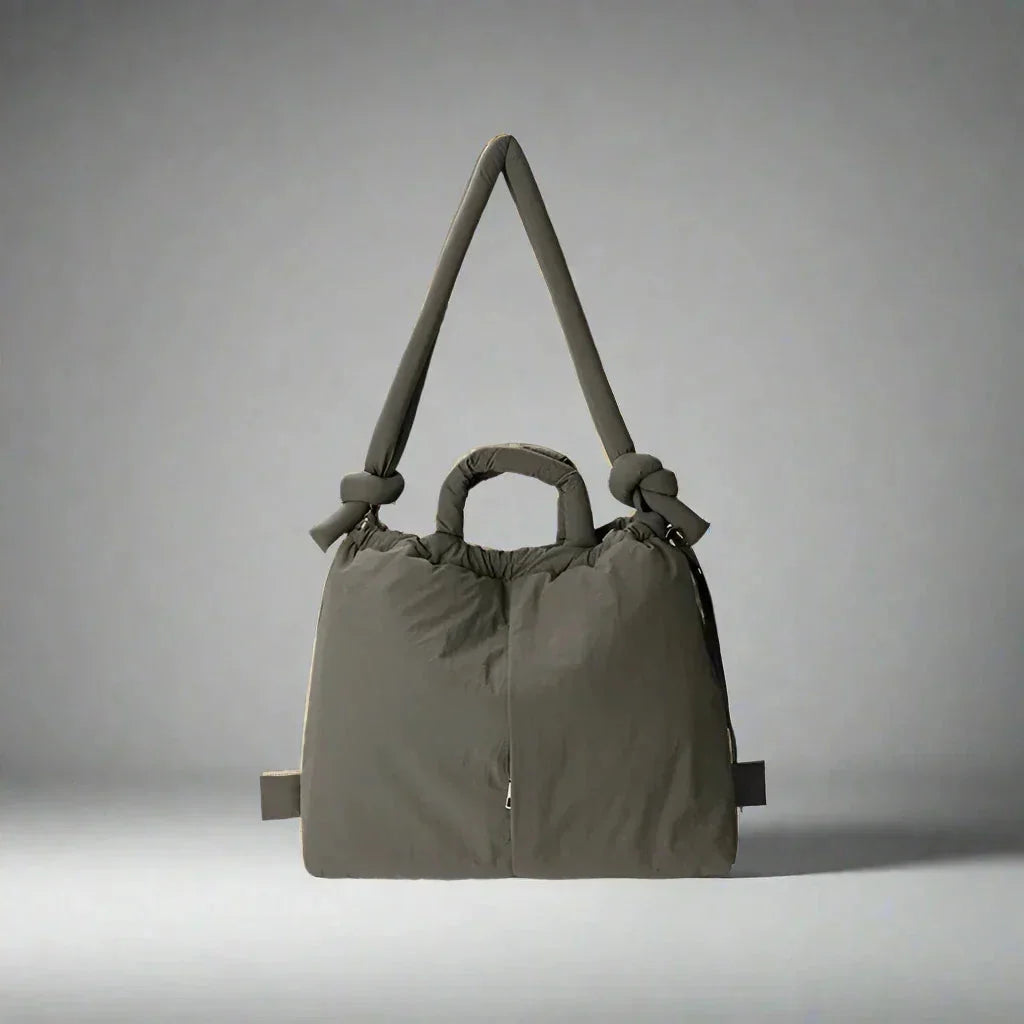 Puffer tote bag for women, featuring a luxurious quilted texture, drawstring sides & unique knot-detail strap.
