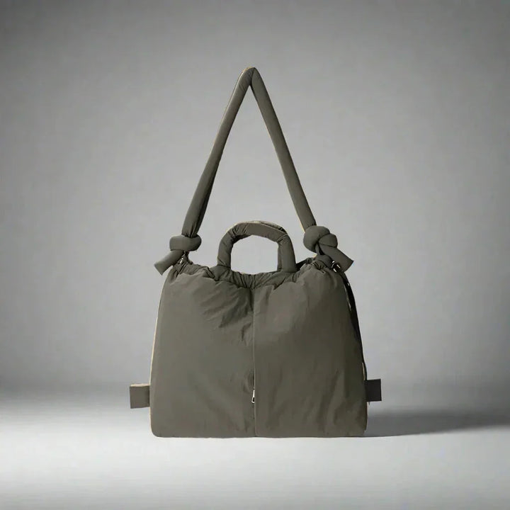 Puffer tote bag for women, featuring a luxurious quilted texture, drawstring sides & unique knot-detail strap.