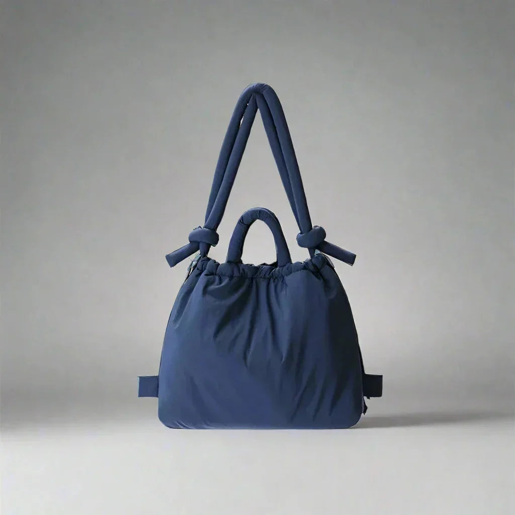 Versatile women's everyday bag: quilted puffer tote with practical drawstring & a stylish knot shoulder strap.