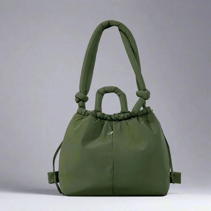 Women's soft quilted puffer shoulder bag, perfect for everyday use. Features drawstring & knot strap.