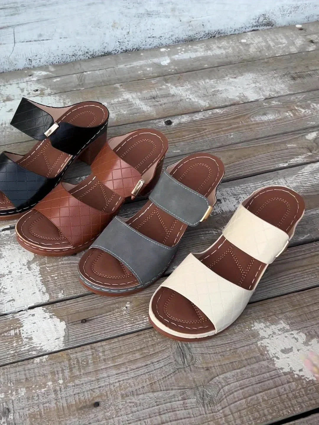 Contemporary women's quilted two-strap platform sandals, chic block heel for modern summer style.