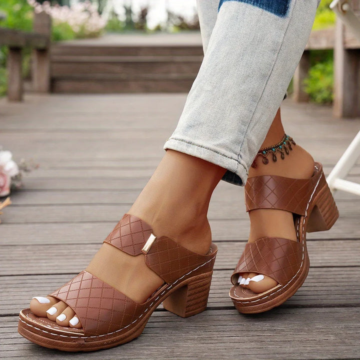 Elegant women's two-strap quilted platform sandals, stylish block heel, chic summer footwear.
