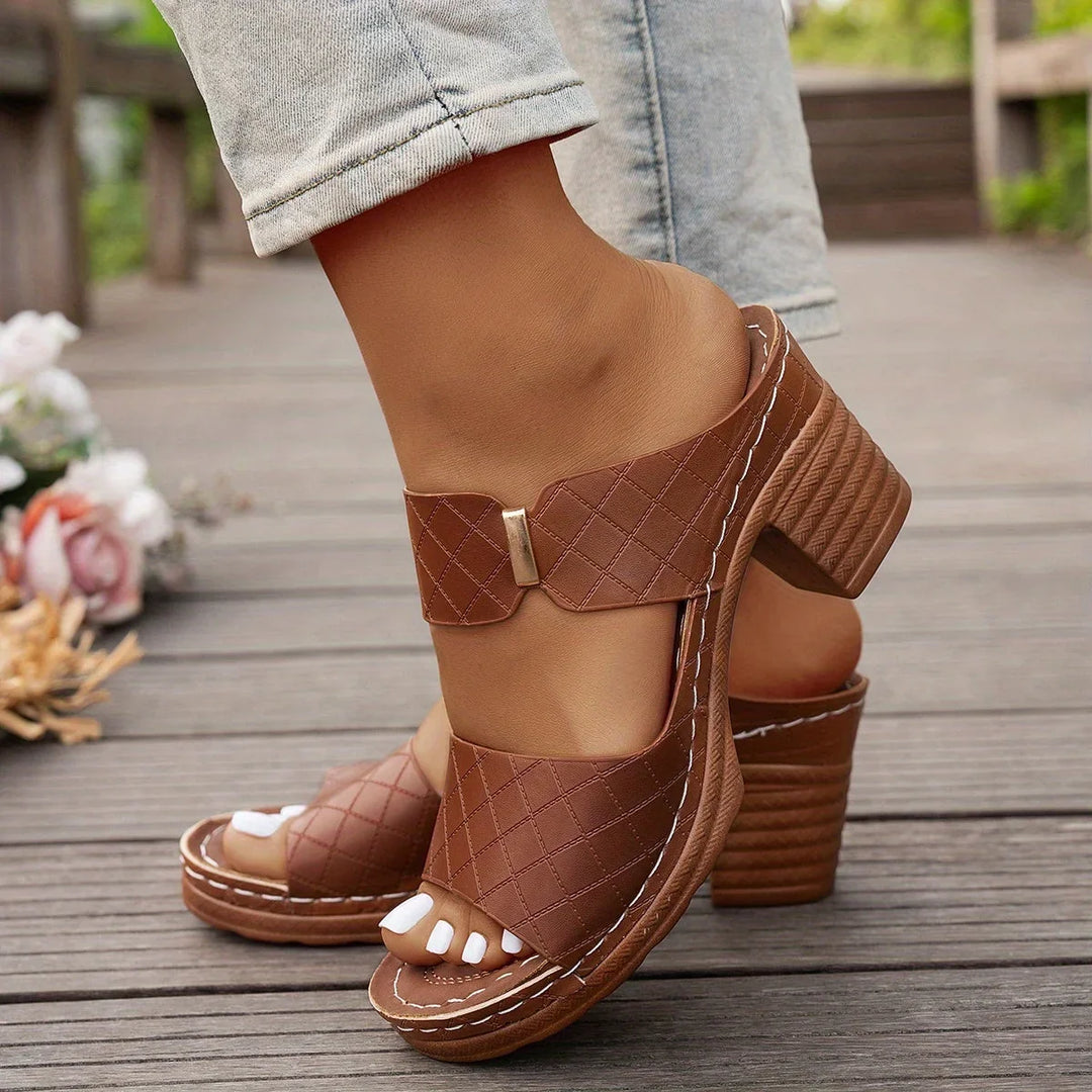 Fashionable women's quilted two-strap platform sandals, modern block heel design for a chic look.