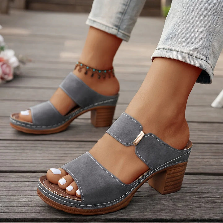 Luxurious quilted two-strap women's platform sandals, secure block heel, elegant summer footwear.