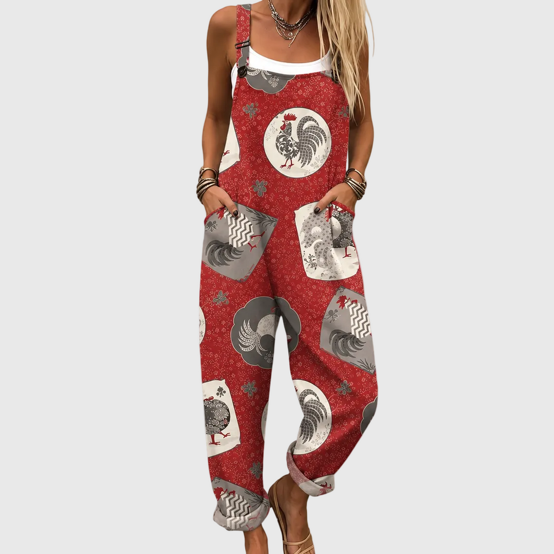 Women's red relaxed fit overalls with vintage rooster print. Comfortable casual jumpsuit, perfect for unique leisure style.