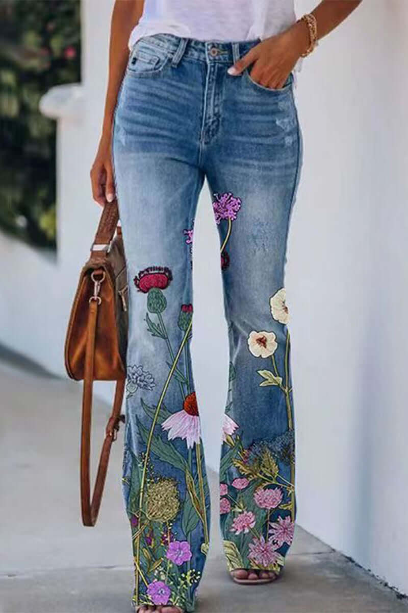 Women's regular fit blue denim jeans with elegant floral embroidery and stylish pocket details.