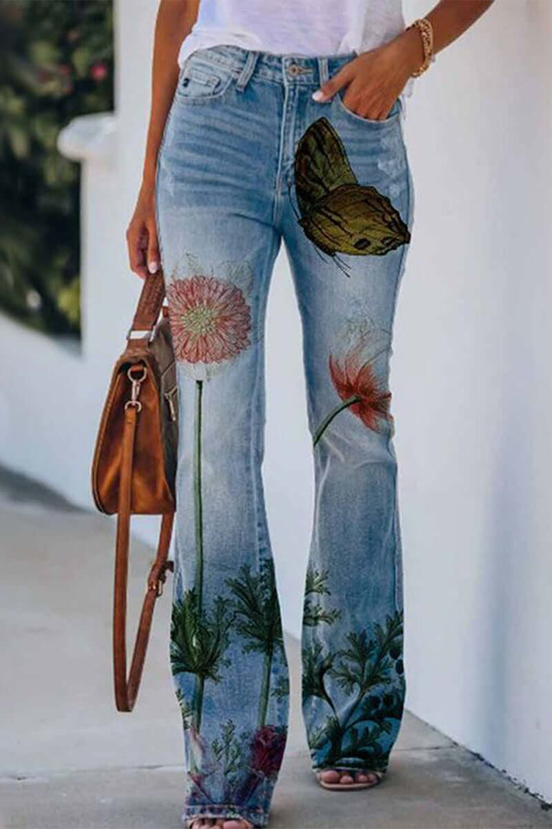 Comfortable women's regular fit blue denim jeans, featuring unique floral embroidery for casual wear.