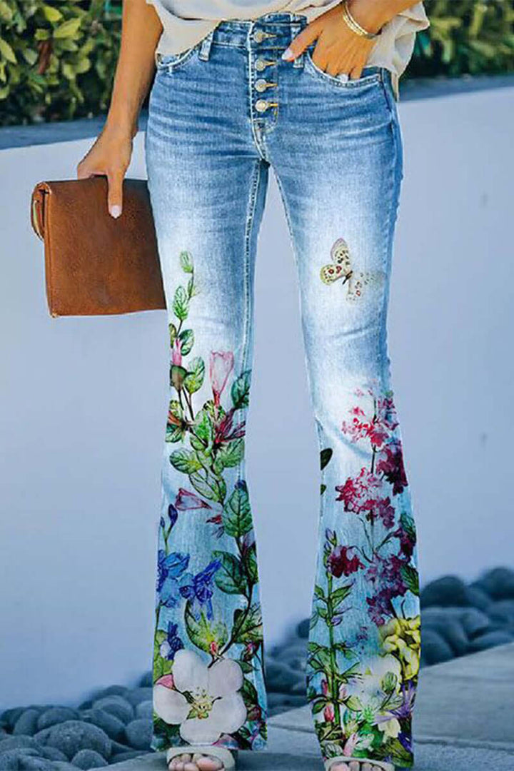 Detail of an embroidered pocket on women's blue floral regular fit jeans, perfect for casual style.