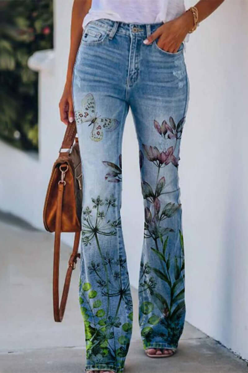 Stylish women's floral embroidered blue denim jeans, regular fit, adding a unique touch to casual outfits.