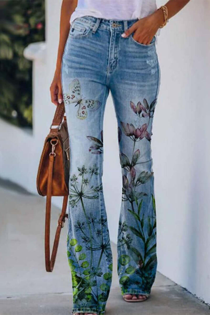 Stylish women's floral embroidered blue denim jeans, regular fit, adding a unique touch to casual outfits.