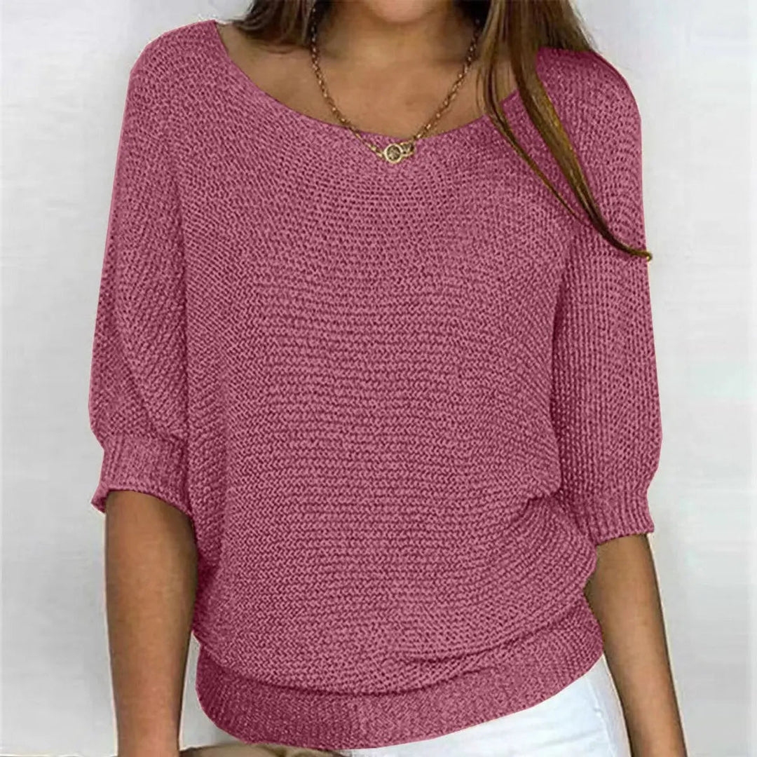 Women's relaxed fit sweater, featuring stylish batwing sleeves for a modern look.