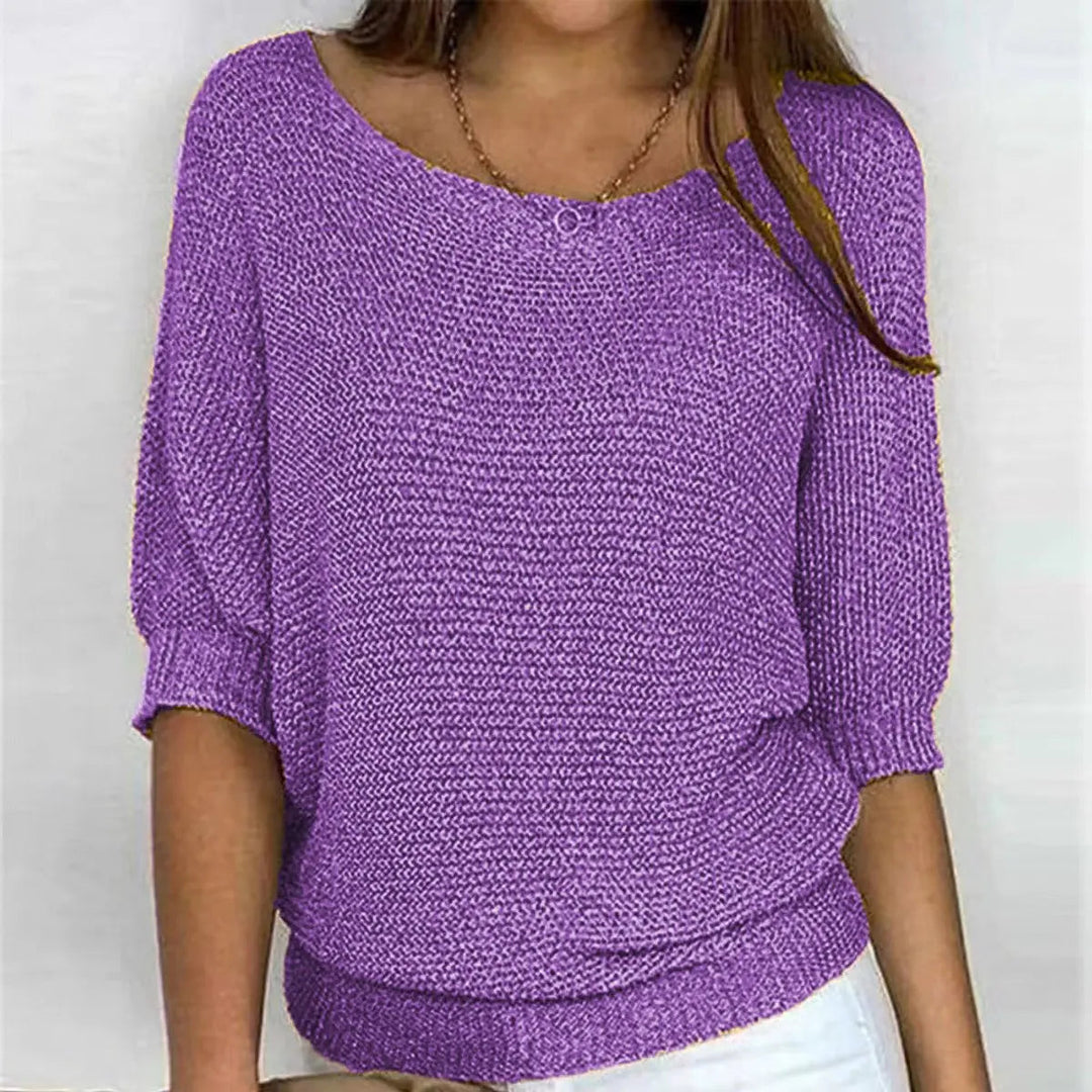 Cozy women's batwing sweater with a relaxed fit, perfect for layering or standalone style.