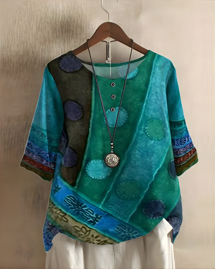 Flowy bohemian women's top, perfect for summer. Features a vibrant, eye-catching print.