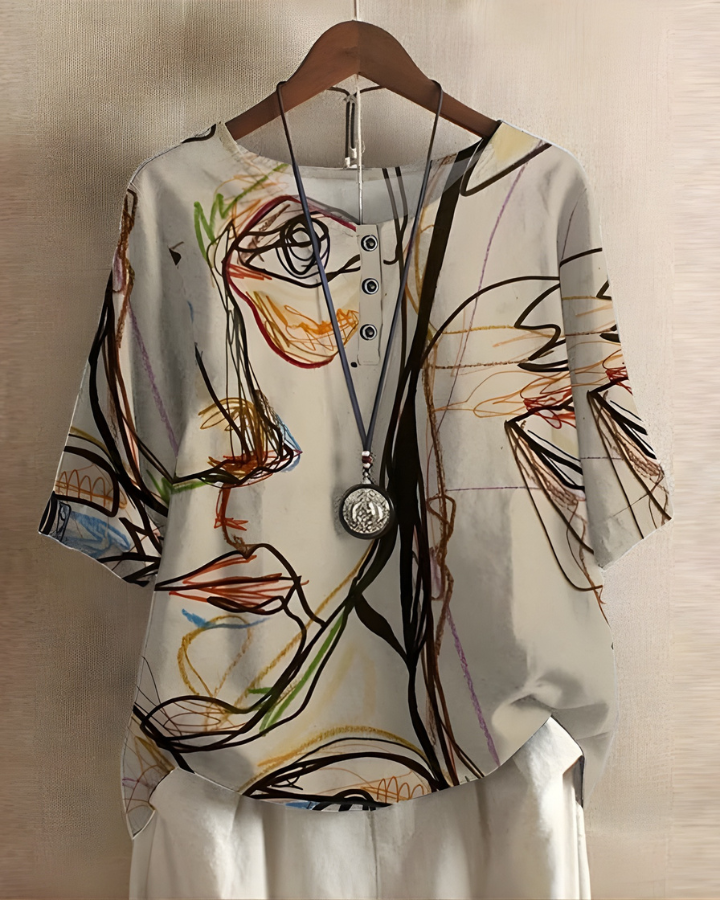 Boho chic women's summer top with a vibrant, unique print. Relaxed and flowy style.