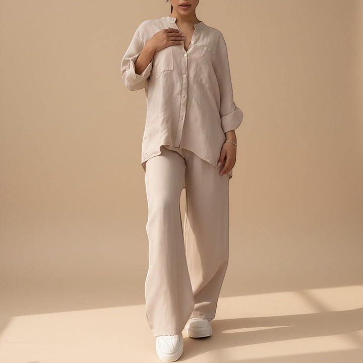 Close-up: relaxed button down shirt, part of women's wide leg pants set. Stylish, comfortable casual top.