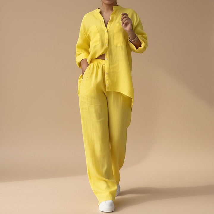 Flat lay: women's relaxed button down shirt & wide leg pants co-ord set. Essential summer fashion lounge outfit.