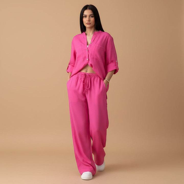 Back view of women's relaxed button down shirt and wide leg pants set. Flowy fit for comfortable casual wear.
