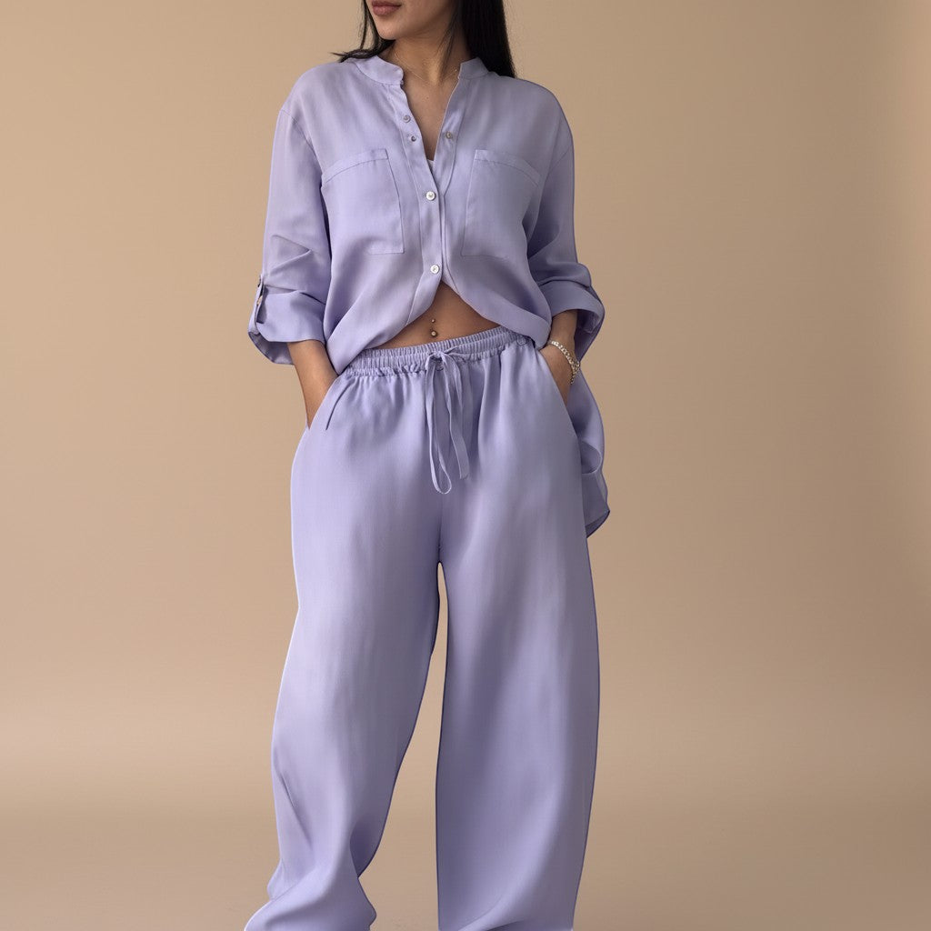 Women's relaxed button down shirt, part of a two-piece lounge set. Versatile top for summer fashion & travel.