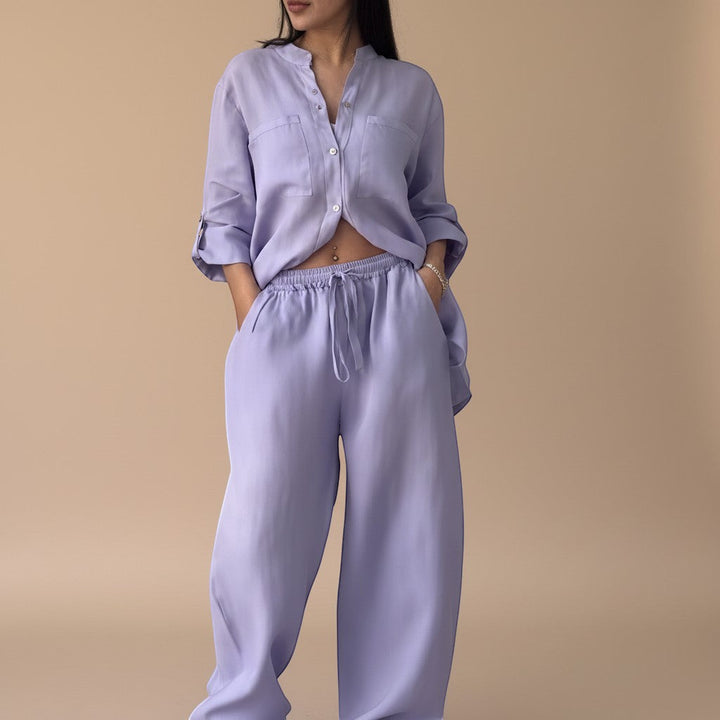 Women's relaxed button down shirt, part of a two-piece lounge set. Versatile top for summer fashion & travel.