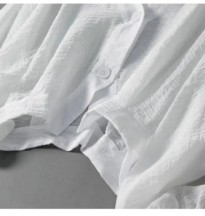 Elegant white women's batwing sleeve blouse with button detail & loose fit. Versatile cotton linen top for spring/summer.