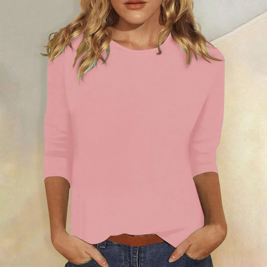 Women's relaxed fit 3/4 sleeve crew neck top, comfortable solid color for versatile everyday wear.
