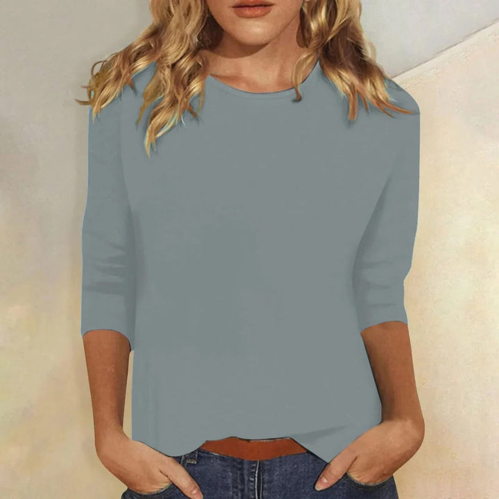 Classic solid color women's relaxed 3/4 sleeve top with a crew neck, great for casual everyday fashion.