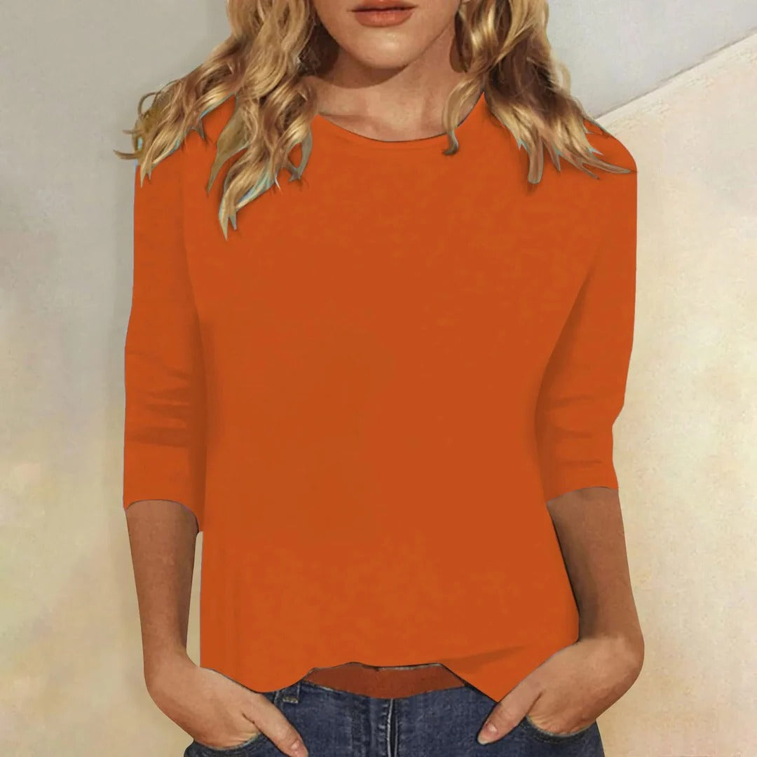 Stylish crew neck women's top with three quarter sleeves, relaxed fit for comfortable casual wear.