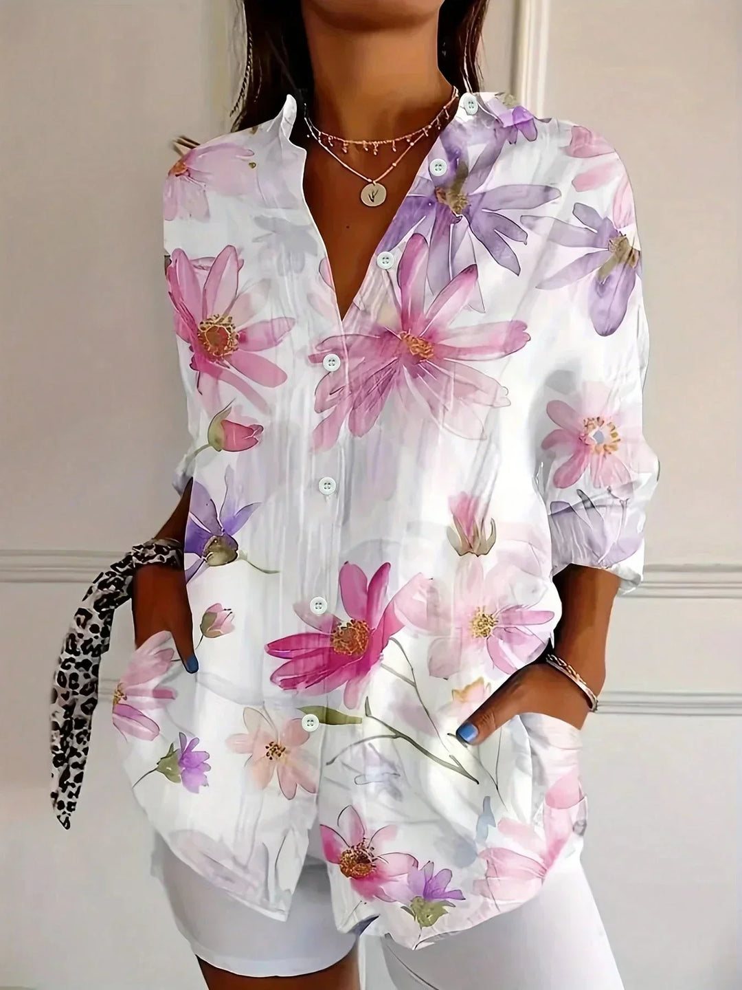 Statement women's relaxed fit blouse with a vibrant, modern abstract print. Comfortable and chic everyday fashion.