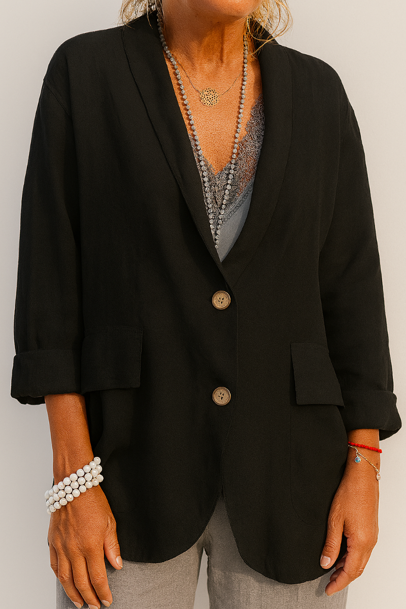 Versatile women's casual blazer, ideal for spring/summer layering, featuring stylish button accents.
