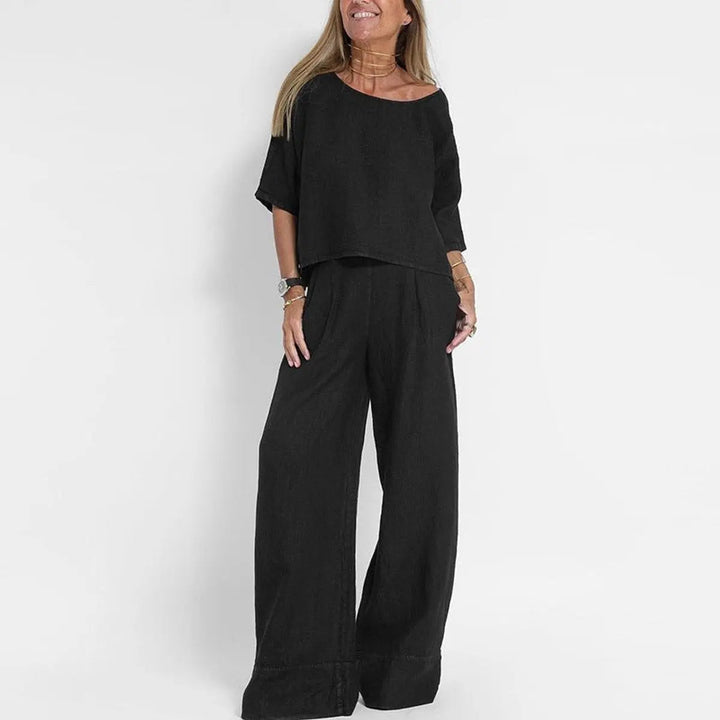 Comfortable women's two-piece set featuring a relaxed-fit blouse and wide-leg trousers for modern style.