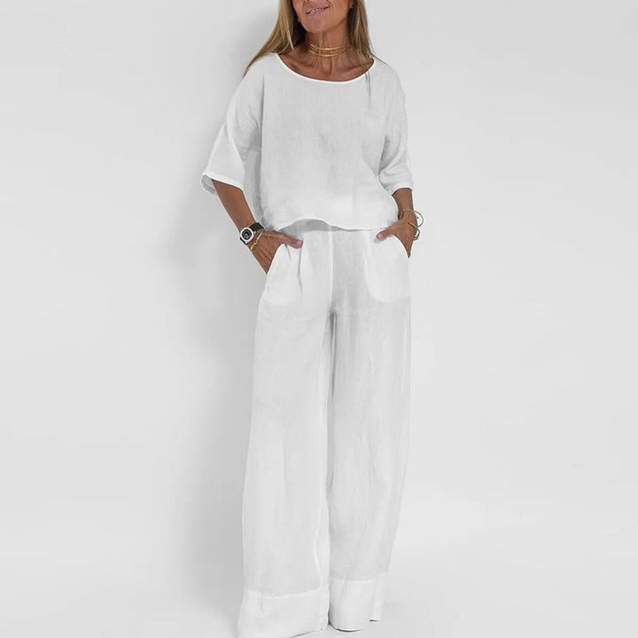 Stylish women's relaxed-fit blouse & wide-leg pants matching set, ideal for spring and summer comfort.