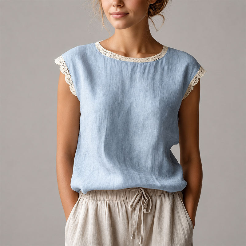 Women's relaxed fit blouse with delicate lace trim, perfect for casual or smart casual everyday wear.